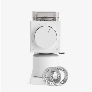 The image displays electric grinder Ode Gen 2 by Fellow. The electric grinder is white. In the image is also possible to check the electric grinder's burr.